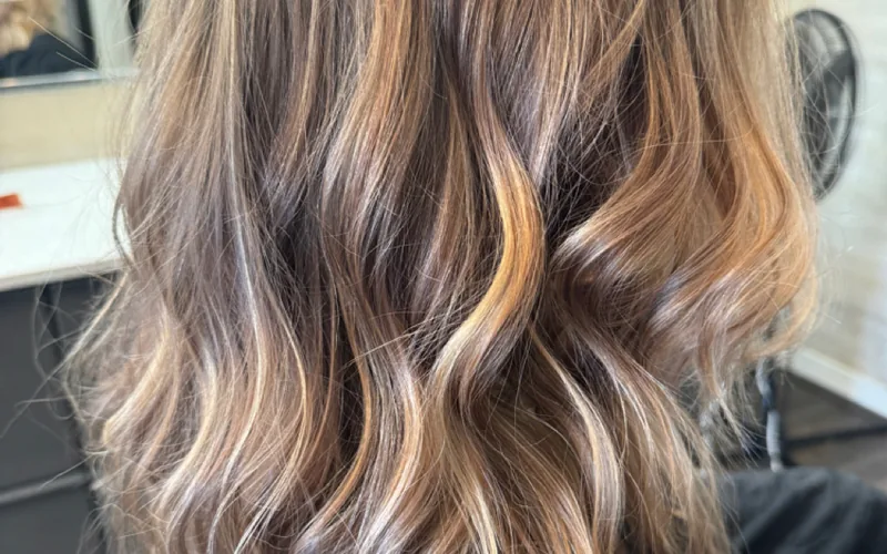Dimensional hand-painted balayage by Erica Wilson