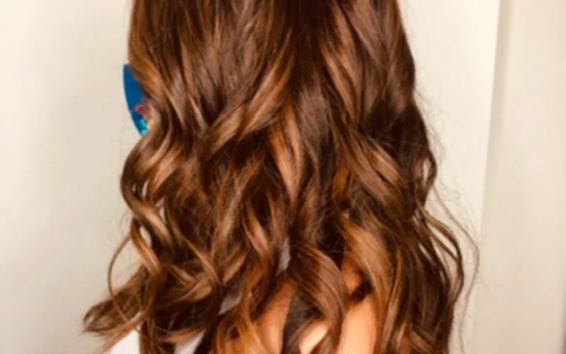 Rich copper all-over color with glossy curls by Erica Wilson
